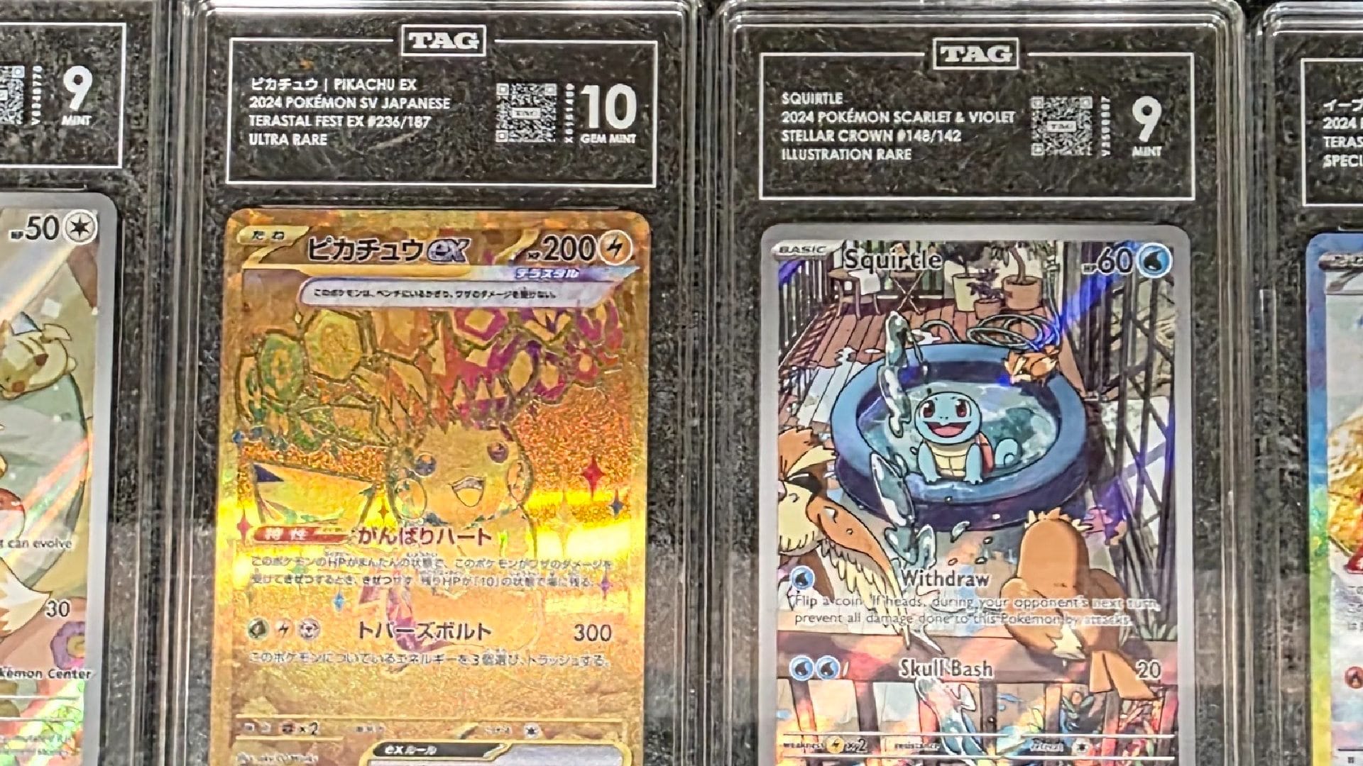 A Pikachu and Squirtle Pokemon cards in a 10 and 9 in TAG slabs
